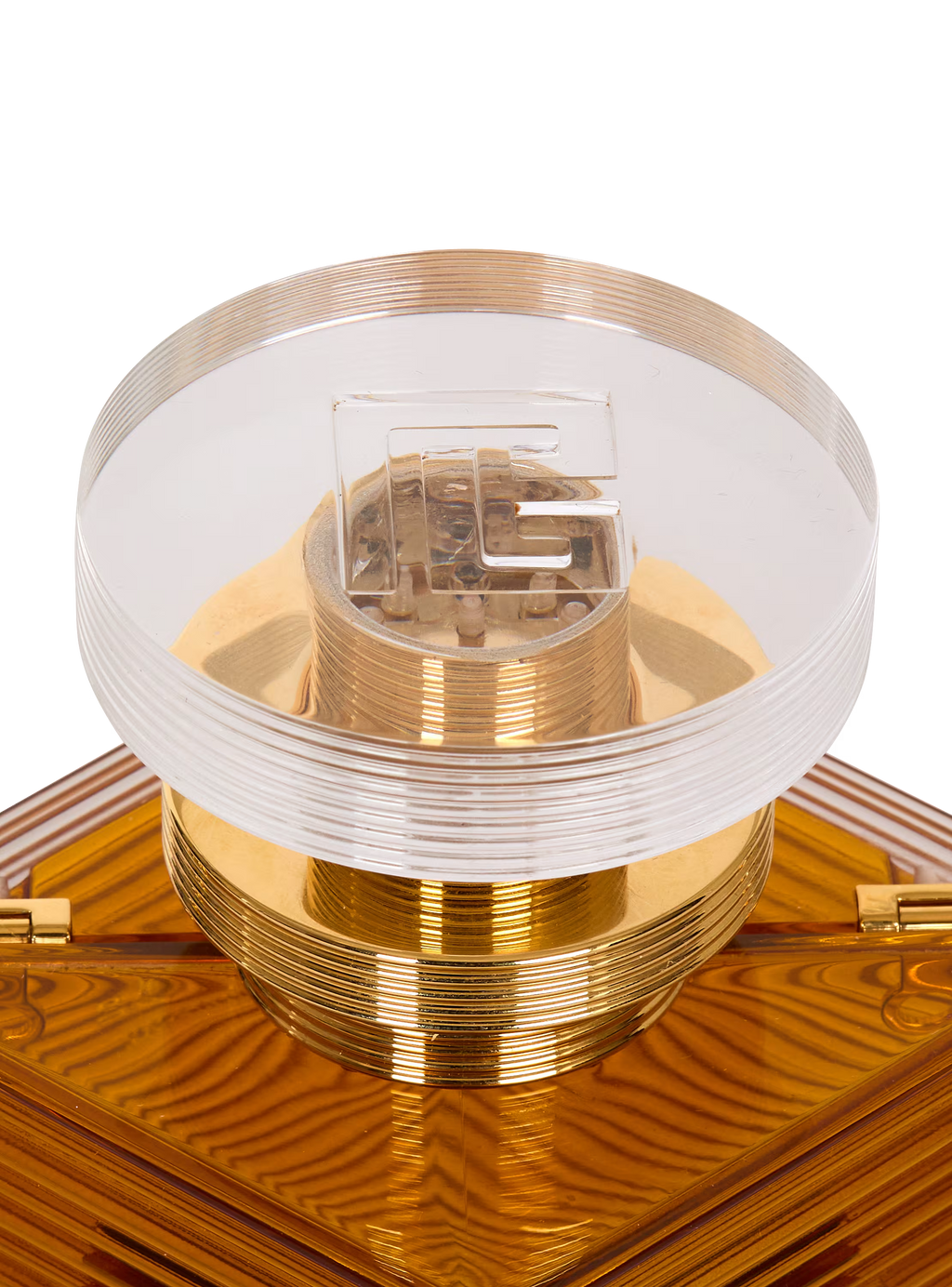 Perfume minaudière in resin and brass