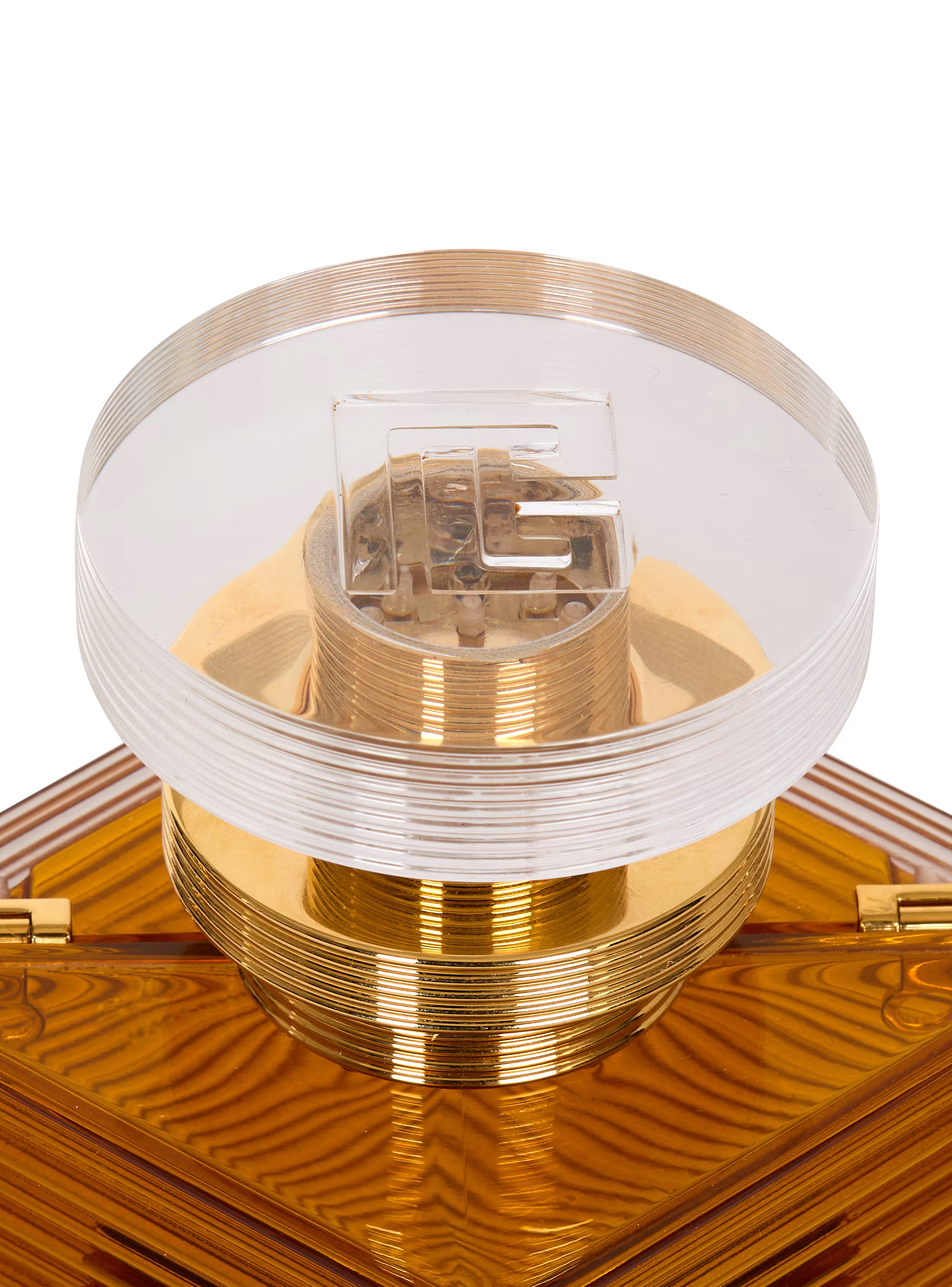 Perfume minaudière in resin and brass